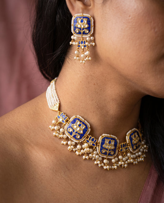 Handcrafted 22kt Gold Blue Lotus Set with 5 Carat Certified Syndicate Polki and Blue Semi Precious Stones in Lotus Motif Thapa Work