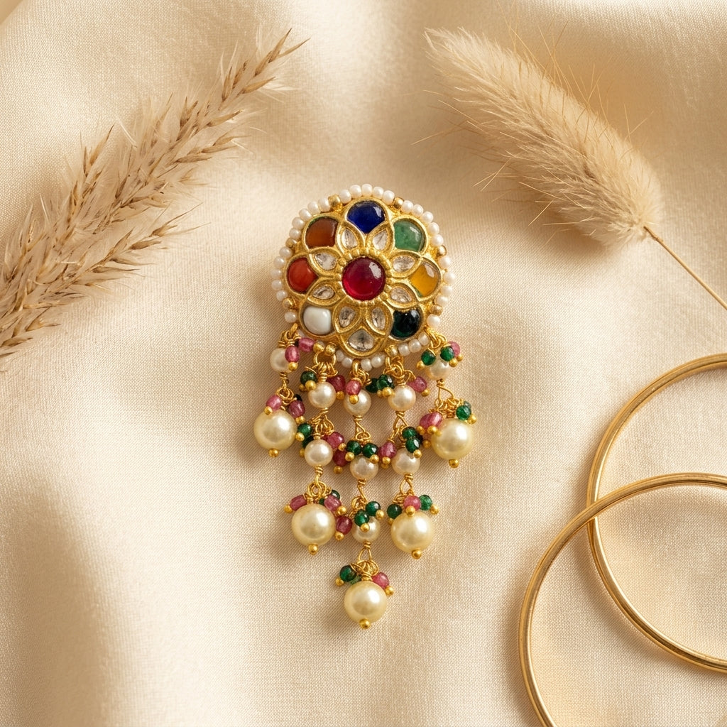 Looking for Navaratna earrings? 22kt gold Navratna Hangings with nine precious gemstones and pearl drops, perfect for bridal and ethnic wear