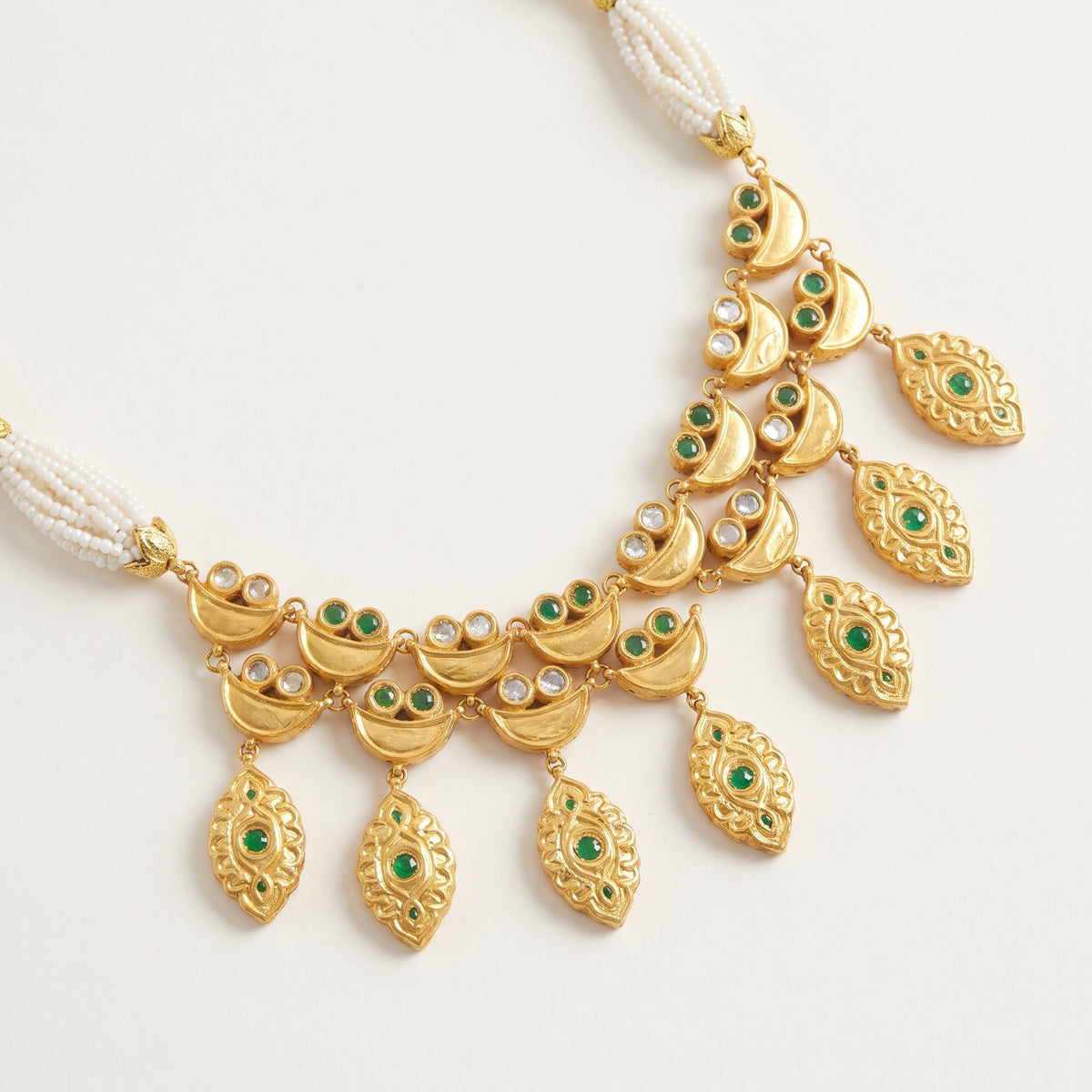 Handcrafted 22kt Gold Emerald Half Moon Set with 5 Carat Certified Syndicate Polki and Emerald Green Semi Precious Stones in Crescent Thapa Work