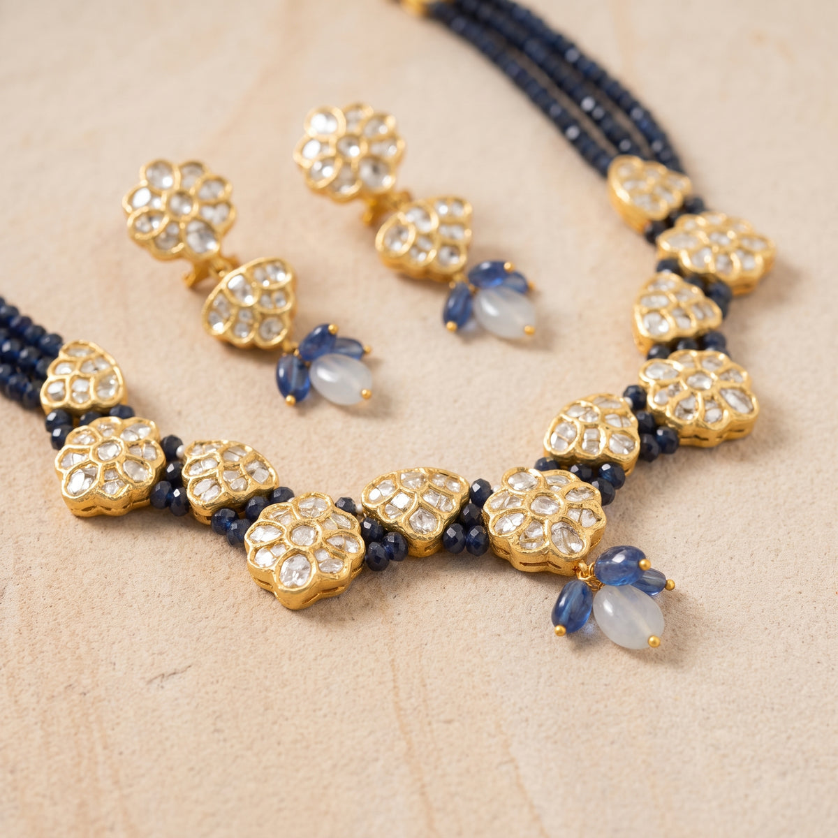 Handcrafted 22kt Gold Jakarti Set with 7 Carat Certified Syndicate Polki and Blue Bead Drops in Thapa Work