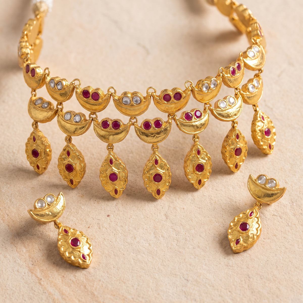 Handcrafted 22kt Gold Red Half Moon Set with 5 Carat Certified Syndicate Polki and Red Semi Precious Stones in Crescent Thapa Work