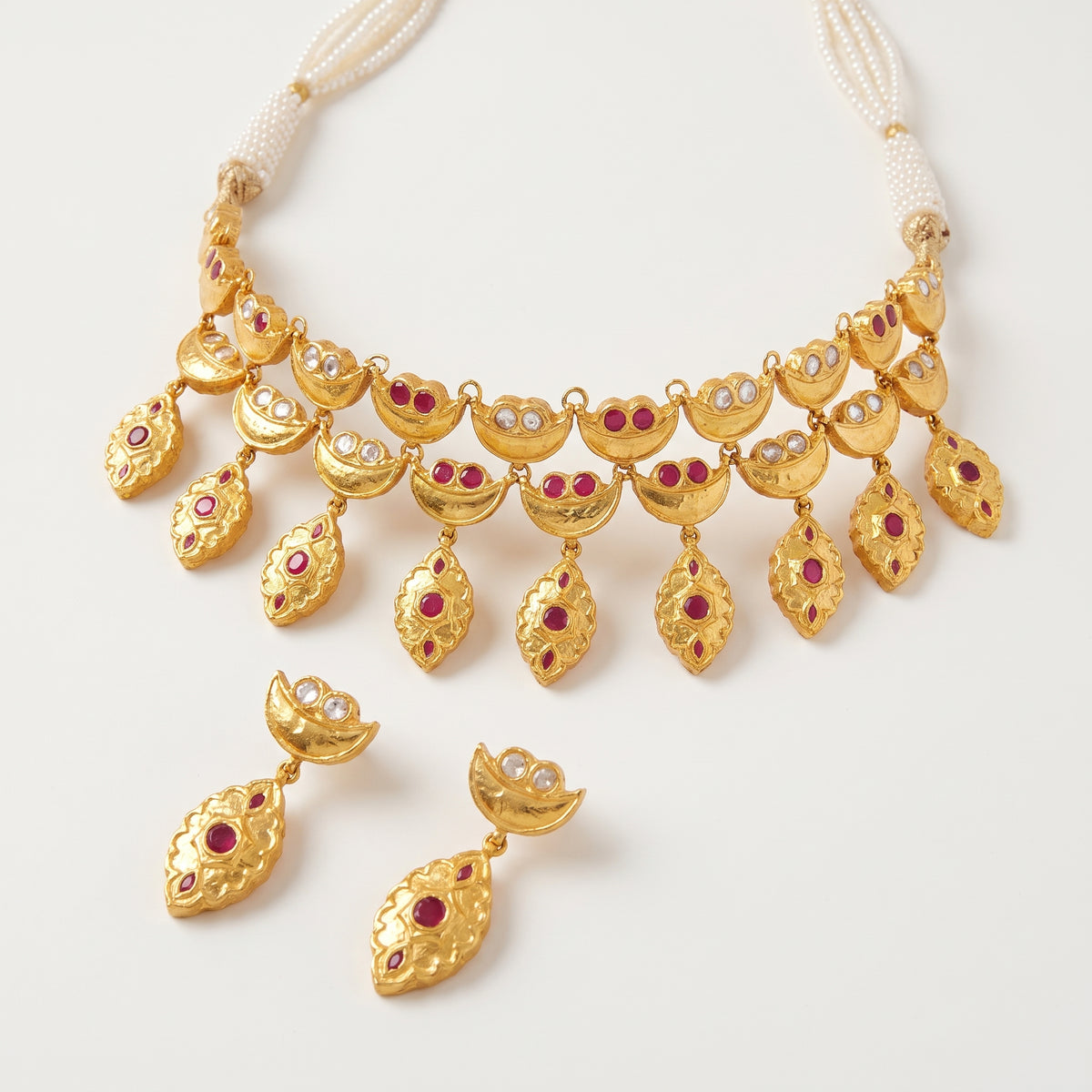 Handcrafted 22kt Gold Red Half Moon Set with 5 Carat Certified Syndicate Polki and Red Semi Precious Stones in Crescent Thapa Work