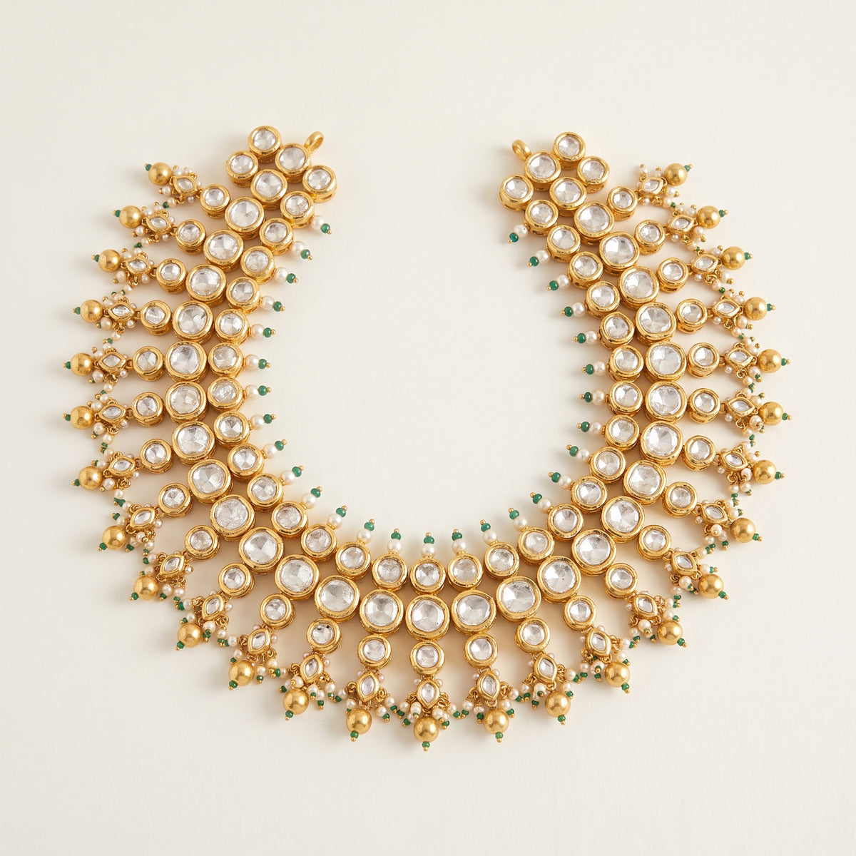 Handcrafted 22kt Gold Three Layer Set with 40 Carat Certified Syndicate Polki Across Three Strands in Thapa Work
