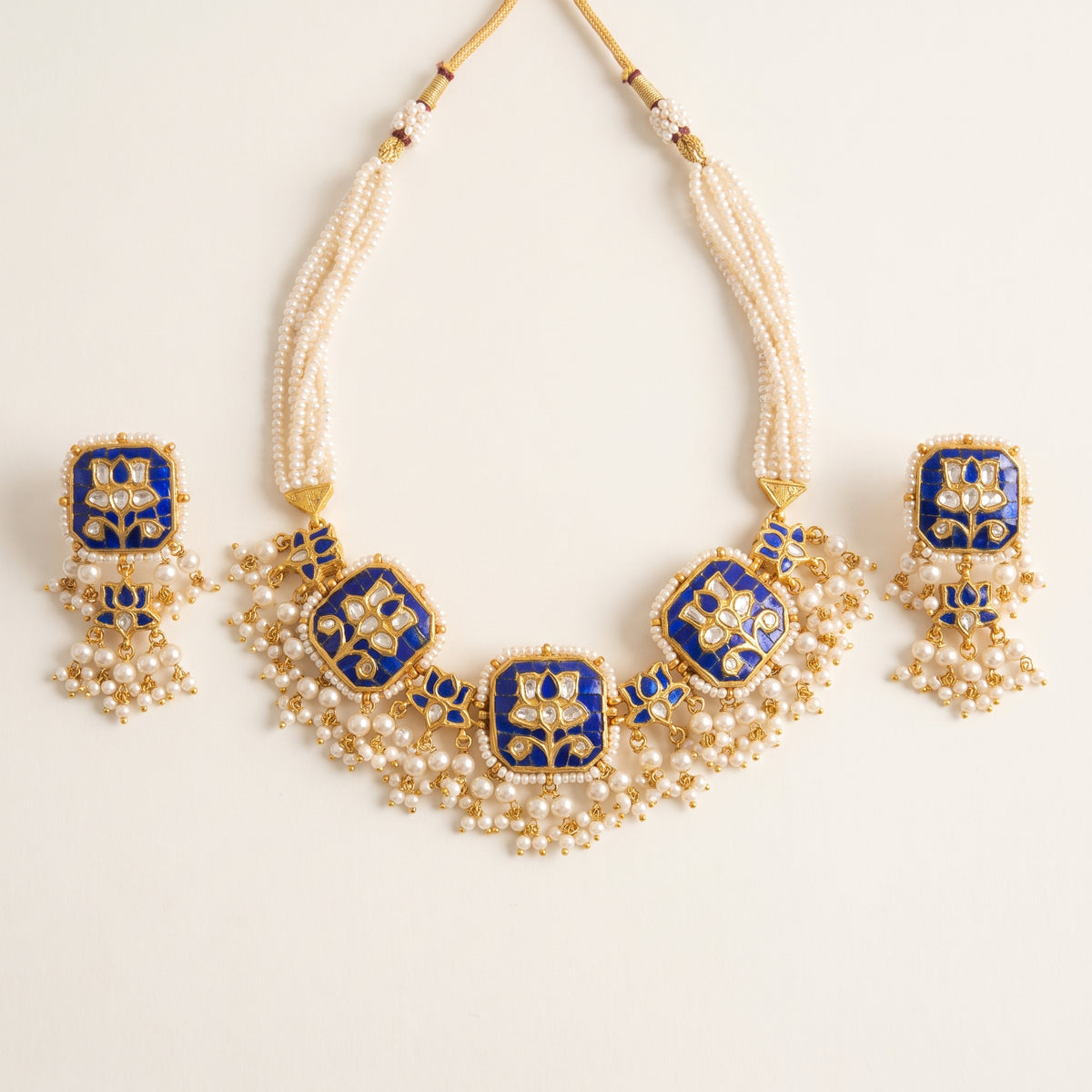 Handcrafted 22kt Gold Blue Lotus Set with 5 Carat Certified Syndicate Polki and Blue Semi Precious Stones in Lotus Motif Thapa Work