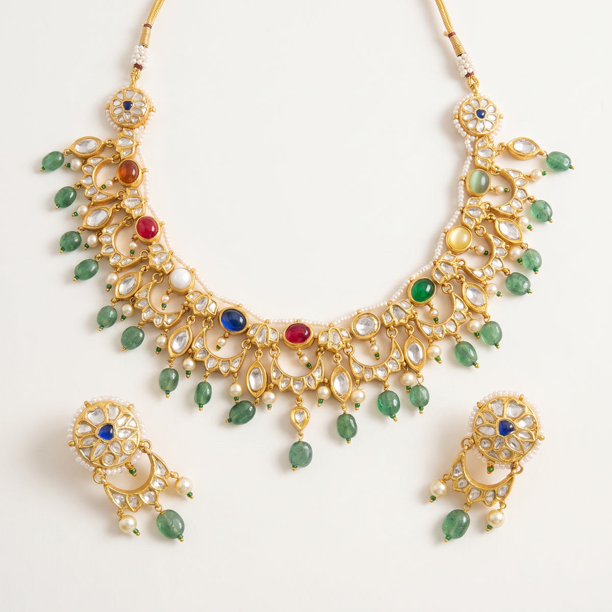 Handcrafted 22kt Gold Navratan Moon Reversible Set with 5 Carat Certified Syndicate Polki and Multi-Colour Semi Precious Stones in Thapa Work