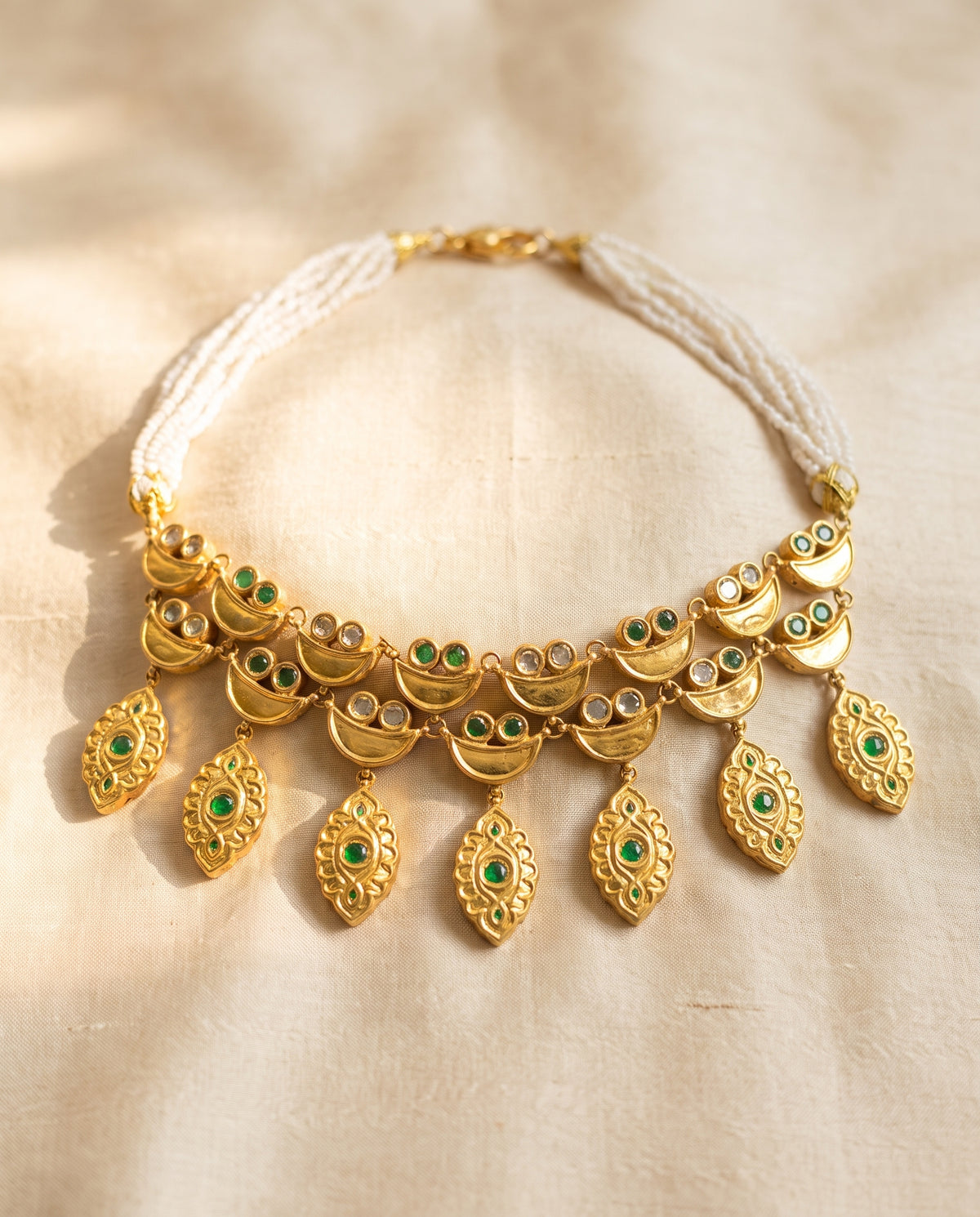 Handcrafted 22kt Gold Emerald Half Moon Set with 5 Carat Certified Syndicate Polki and Emerald Green Semi Precious Stones in Crescent Thapa Work